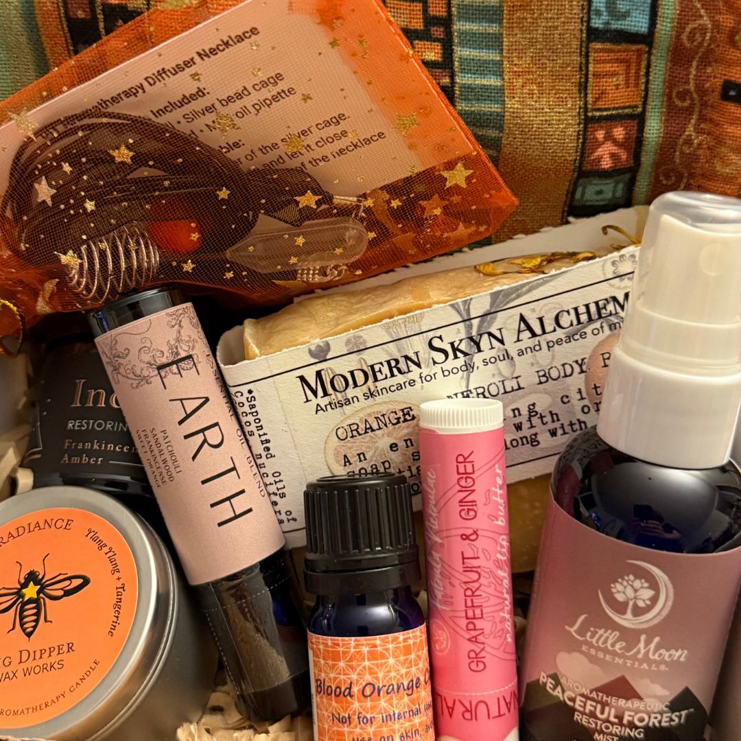 Seasonal Fall Gift Box With a Collection of natural skincare and wellness products including bottles, candles, and soap.